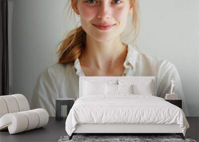 female startup employee, 26 years old, french, smiling, casual attire, arms crossed, white backgroun Wall mural