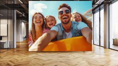 Happy Family Enjoying a Thrilling Amusement Park Ride Under a Bright Sky With Colorful Attractions in the Background Wall mural