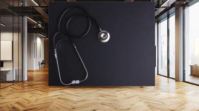 Stethoscope on black background with space for text - health con Wall mural