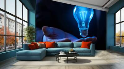 Businessman holding lightbulb, symbolizing creativity and innovation, brainstorming for solutions and development, bright idea concept, glowing with energy and inspiration, knowledge vision Wall mural