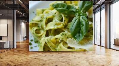 Closeup of pasta with green pesto sauce and leaf on a plate. Traditional Italian Mediterranean lunch or dinner meal dish, healthy vegetarian cuisine cooking, delicious tasty gourmet nutrition Wall mural