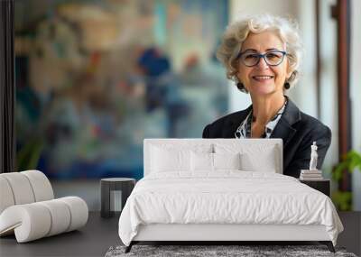 Senior businesswoman, successful and confident manager boss with career experience, looking at camera in corporate office, mature and happy executive in 60s with grey hair, leadership and profession Wall mural