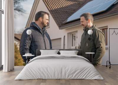 Two Middle Aged Men Talking In Front Of A House With Solar Panels Wall mural