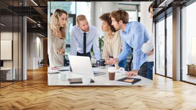 Small group of business people standing at office and solving problem at meeting. Multi cultural group. Wall mural