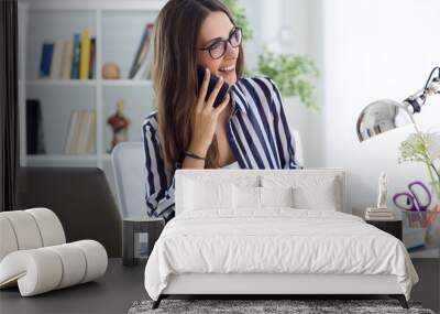 beautiful young woman working in the office. Wall mural