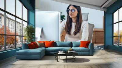 Business young woman working with computer in a modern office. Wall mural