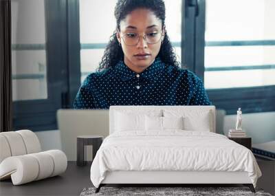 Business young woman working with laptop in the office. Wall mural