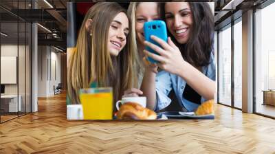 friends having fun with smartphones Wall mural