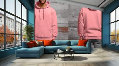 photo of pink hoodie sweater with front and back view isolated on wooden wall background. generative ai Wall mural