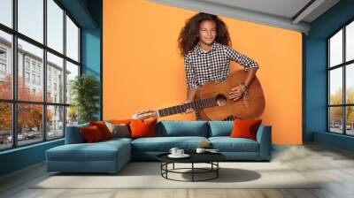 African american teenage girl with guitar. Wall mural