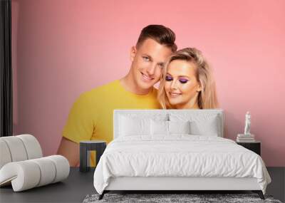 Beautiful young couple smiling. Wall mural