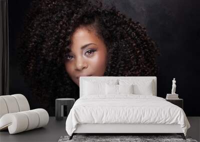 Beauty portrait of young girl with afro. Wall mural