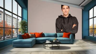 Handsome teenage boy in hoodie. Wall mural