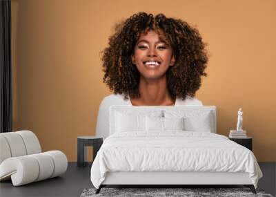 Happy african american woman smiling. Wall mural