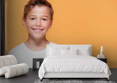 Happy little boy smiling to the camera. Wall mural