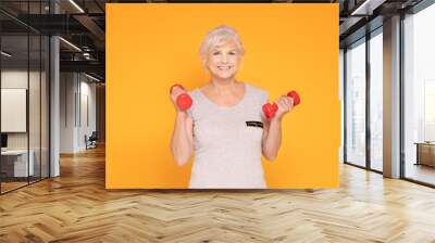 Happy senior woman exercising. Wall mural