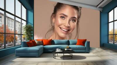 Portrait of smiling beauty young woman. Wall mural