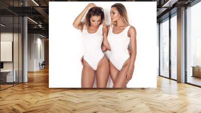 sensual twins women posing on white background. Wall mural