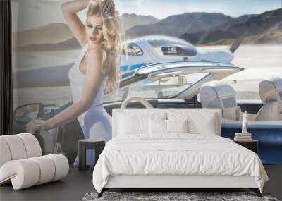 Sexy woman with luxury car and airplane. Wall mural