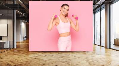 Smiling girl enjoying fitness training. Wall mural