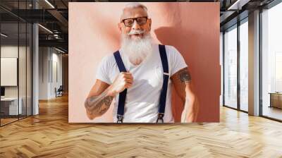 Smiling senior man wearing fashionable clothes. Wall mural