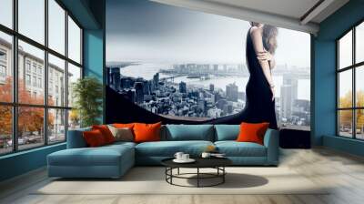 Stylish elegant woman posing in evening dress. Wall mural