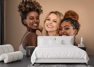 Three Beautiful Diverse Girls Posing together, smiling and looking at camera. Wall mural