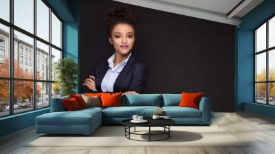 Young beautiful business woman posing. Wall mural