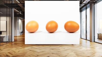 Brown eggs on a white background Wall mural