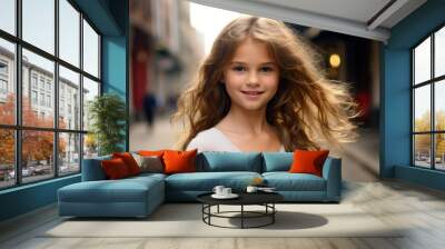 portrait of a beautiful little girl with flying hair in the city Wall mural