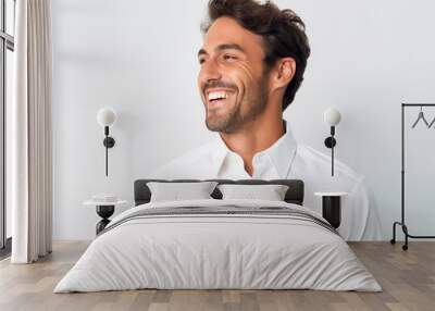 Portrait of a handsome young man smiling isolated on a white background Wall mural