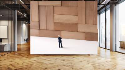 Giant wall and miniature businessman Wall mural