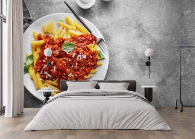 Bolognese penne pasta served on plate Wall mural