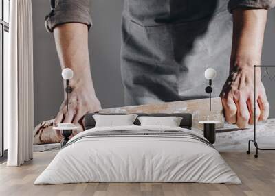 Chef making and kneading fresh dough Wall mural