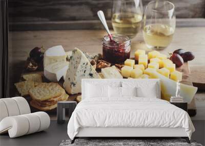 Different arts of cheese with grape on wooden Wall mural