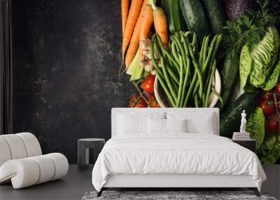 Different raw vegetables on rough table Wall mural