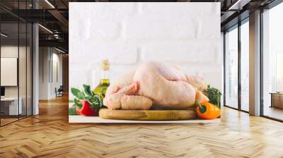 Ingredients for cooking on kitchen table with chicken and vegetables Wall mural