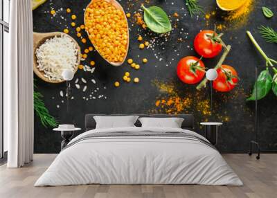 Ingredients for cooking placed on black background. Wall mural