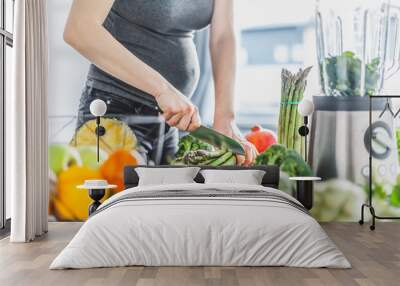 Pregnant woman cooking healthy food Wall mural