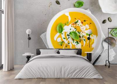 Pumpkin creamy soup served in bowl Wall mural