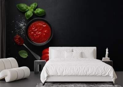 Tomato sauce in bowl on dark Wall mural