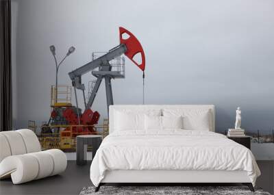 Oil pump in winter Wall mural