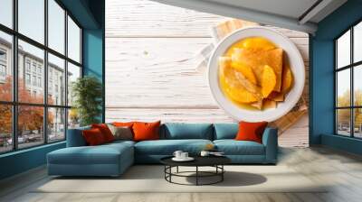 Crepe suzette, traditional french dessert with thin pancakes and orange sauce. Wall mural