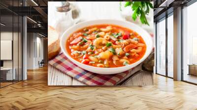 Italian minestrone soup on white wooden background. Wall mural