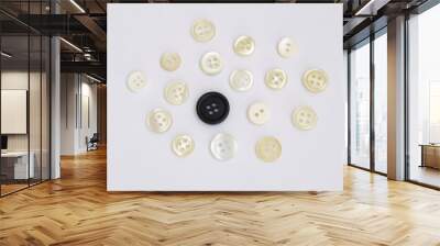 group of white buttons and a black button Wall mural