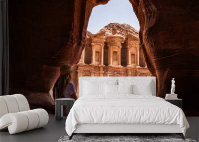 Blonde woman in viewpoint of The Monastery, ancient city of Petra, Jordan Wall mural