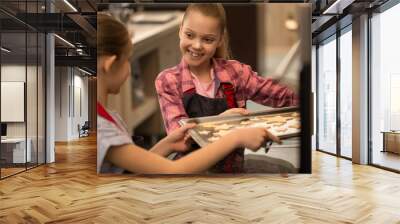 Two little girls sisters cooking together Wall mural