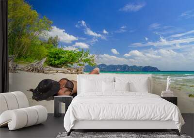 Cute woman relaxing on the tropical beach. Vacation at Paradise. Ocean beach relax, travel to islands Wall mural