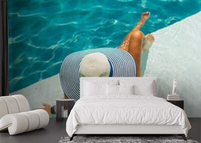 Woman relaxing in swimming pool at spa resort. r Wall mural