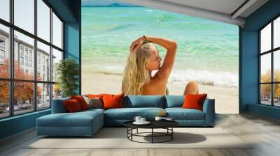 Young woman at the tropical beach Wall mural